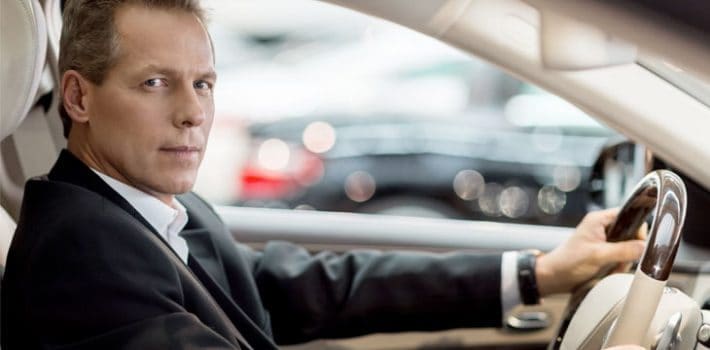 Airport Transfer Chauffeur Professional chauffeur in a suit providing executive drive-as-directed service in St. Louis.